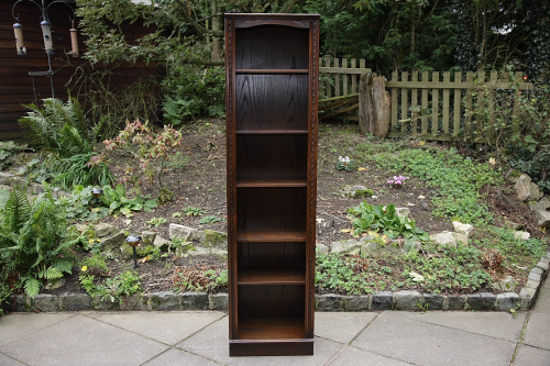 A JAYCEE CARVED OAK BOOKCASE DISPLAY CABINET WALL SHELVES.