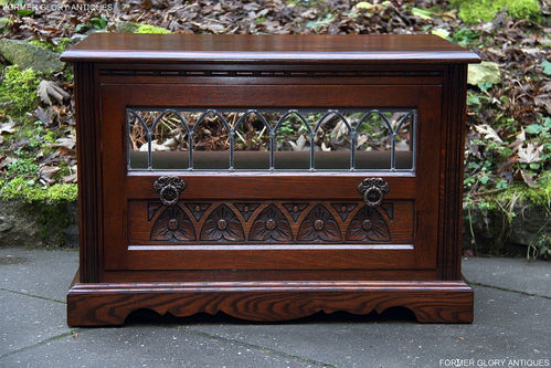 A WOOD BROTHERS OLD CHARM TUDOR BROWN CARVED OAK TV CABINET STAND