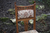 A SET OF FOUR OAK ARTS & CRAFTS UPHOLSTERED DINING CHAIRS.