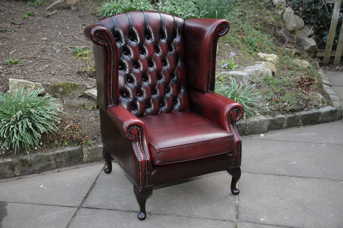 A Thomas Lloyd Ox Blood Red Leather, Oxblood Leather Wingback Chair