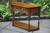 A WOOD BROTHERS OLD CHARM LIGHT OAK CANTED CONSOLE / HALL TABLE.