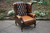 A THOMAS LlOYD ANTIQUE BROWN LEATHER CHESTERFIELD BUTTON WING-BACK SOFA SUITE ARMCHAIR.