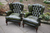 A PAIR OF ANDREW MUIRHEAD ANTIQUE GREEN LEATHER CHESTERFIELD BUTTON WING-BACK SOFA SUITE ARMCHAIRS.