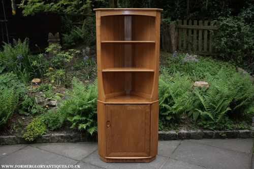 AN ERCOL LIGHT ELM CORNER DISPLAY CABINET CUPBOARD SHELVES BOOKCASE STAND TABLE.