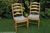 A SET OF FOUR ERCOL LIGHT ELM LADDERBACK PENN KITCHEN DINING TABLE CHAIRS + CUSHIONS PADS.