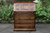 AN OLD CHARM WOOD BROS LIGHT OAK WRITING TABLE BUREAU COMPUTER OFFICE DESK CHEST OF DRAWERS.