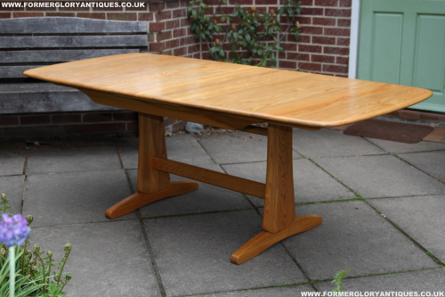 AN ERCOL WINDSOR SOLID LIGHT ELM ASH EXTENDING ONE LEAF OVAL DINING KITCHEN TABLE