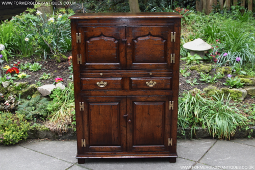 A TITCHMARSH AND GOODWIN STRESSED SOLID OAK WINE / DRINKS CABINET / CUPBOARD
