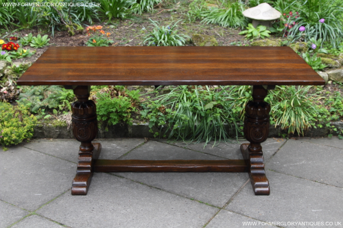 A TITCHMARSH AND GOODWIN STRESSED SOLID CARVED OAK REFECTORY TRESTLE KITCHEN DINING TABLE.
