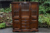 A WOOD BROTHERS OLD CHARM LIGHT OAK TALL RECESSED SIDEBOARD DISPLAY CABINET