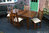 A WOOD BROTHERS OLD CHARM LIGHT OAK EXTENDING DINING TABLE AND FOUR MATCHING UPHOLSTERED CHAIRS