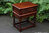 A WOOD BROTHERS OLD CHARM TUDOR BROWN COFFEE / LAMP TABLE