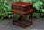 A WOOD BROTHERS OLD CHARM TUDOR BROWN COFFEE / LAMP TABLE