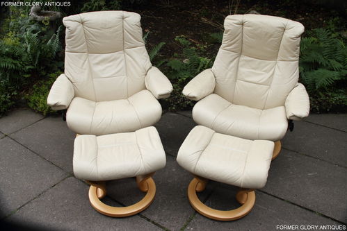 PAIR OF EKORNES STRESSLESS RECLINER SWIVEL LEATHER ARMCHAIRS WITH FOOTSTOOLS
