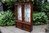 A LARGE BEVAN FUNNELL STYLE MAHOGANY CHINA / DISPLAY CABINET
