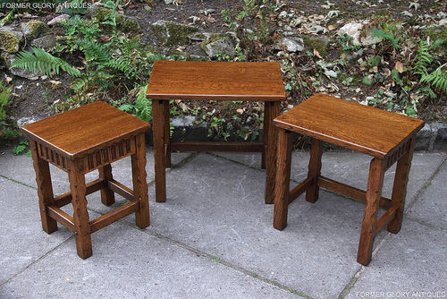 RUPERT / NIGEL GRIFFITHS MONASTIC CARVED OAK NEST OF THREE TABLES