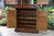 A WOOD BROTHERS OLD CHARM LIGHT OAK DRINKS / COCKTAIL / WINE CABINET