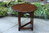 A CHINGFORD REPRODUCTIONS CARVED OAK DROP LEAF COFFEE TABLE