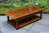A LARGE SOLID STRESSED TUDOR OAK TWO DRAWER COFFEE TABLE