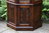 A WOOD BROTHERS OLD CHARM CARVED LIGHT OAK CANTED DISPLAY CABINET / DRESSER