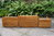 AN ERCOL WINDSOR LIGHT ELM NEST OF THREE TABLES / COFFEE TABLE SET