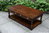A TITCHMARSH AND GOODWIN STYLE STRESSED OAK TWO DRAWER COFFEE TABLE