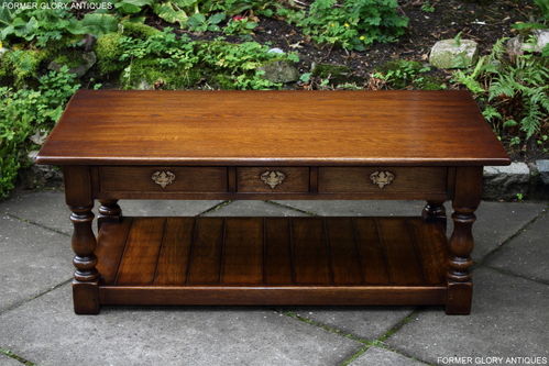 A TAYLOR & Co SOLID STRESSED OAK THREE DRAWER POT BOARD COFFEE TABLE