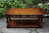 A TAYLOR & Co SOLID STRESSED OAK THREE DRAWER POT BOARD COFFEE TABLE