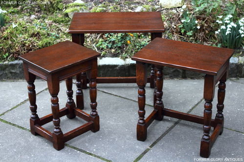 A TITCHMARSH AND GOODWIN NEST OF THREE STRESSED OAK TABLES / COFFEE TABLE SET