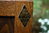A WOOD BROTHERS OLD CHARM LIGHT OAK CANTED CABINET / HALL TABLE