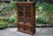 A WOOD BROTHERS OLD CHARM CARVED LIGHT OAK BOOKCASE / DISPLAY CABINET