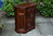 A WOOD BROTHERS OLD CHARM TUDOR BROWN CARVED OAK CANTED CABINET / CUPBOARD