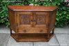 A JAYCEE AUTUMN GOLD CARVED OAK CANTED HALL CUPBOARD / SIDEBOARD