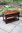 A WOOD BROTHERS OLD CHARM TUDOR BROWN CARVED OAK TWO DRAWER COFFEE TABLE