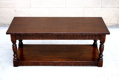 A NIGEL GRIFFITHS MONASTIC SOLID CARVED OAK COFFEE / OCCASIONAL TABLE