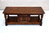 A WOOD BROTHERS OLD CHARM CARVED LIGHT OAK LONG COFFEE TABLE WITH CUPBOARD