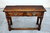 A TITCHMARSH AND GOODWIN STYLE JACOBEAN STRESSED OAK TWO DRAWER HALL CONSOLE / SIDE TABLE