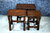 A NIGEL GRIFFITHS MONASTIC CARVED SOLID OAK NEST OF TABLES / COFFEE TABLE SET