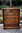 A WOOD BROTHERS OLD CHARM CARVED LIGHT OAK TALL CHEST OF SIX DRAWERS