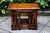 A WOOD BROTHERS OLD CHARM LIGHT OAK NEST OF THREE TABLES / COFFEE TABLE SET