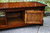 A WOOD BROTHERS OLD CHARM LIGHT OAK LONG COFFEE TABLE WITH CUPBOARD