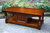 A WOOD BROTHERS OLD CHARM LIGHT OAK LONG COFFEE TABLE WITH CUPBOARD