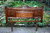 A WOOD BROTHERS OLD CHARM CARVED LIGHT OAK DOUBLE BED HEADBOARD